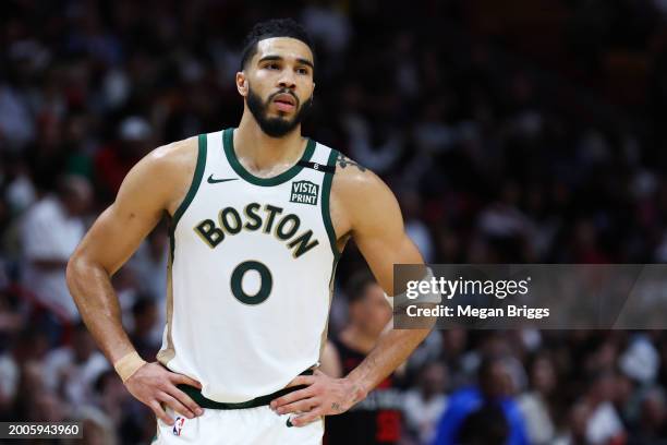 Jayson Tatum of the Boston Celtics looks on against the Miami Heat during the third quarter of the game at Kaseya Center on February 11, 2024 in...