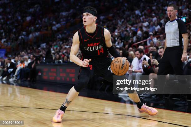 Tyler Herro of the Miami Heat dribbles the ball against the Boston Celtics during the third quarter of the game at Kaseya Center on February 11, 2024...