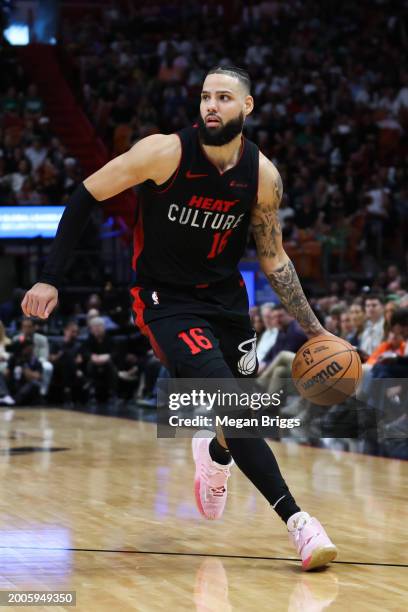 Caleb Martin of the Miami Heat dribbles the ball against the Boston Celtics during the fourth quarter of the game at Kaseya Center on February 11,...