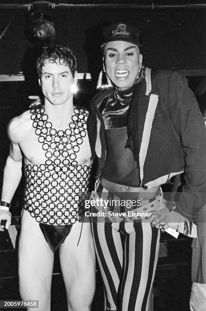 Portrait of American drag performer RuPaul Andre Charles and guest at the Roxy nightclub, New York, New York, April 14, 1990.