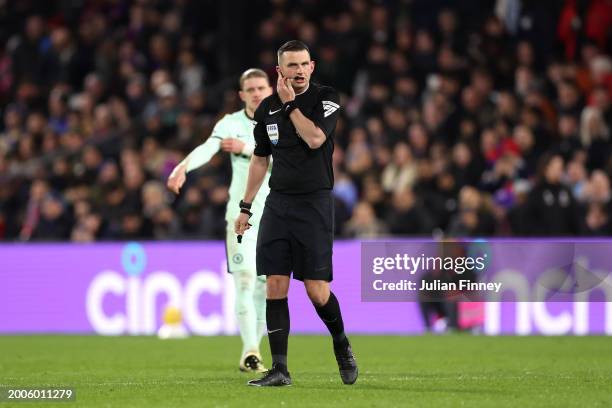 Match Referee Michael Oliver checks his microphone during the Premier League match between Crystal Palace and Chelsea FC at Selhurst Park on February...