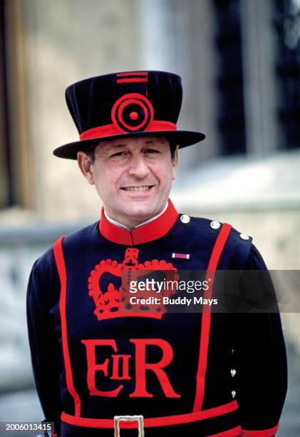 Portrait of a smiling Beefeater, a palace guard at the Tower of London, London, England, United Kingdom, 1999. .
