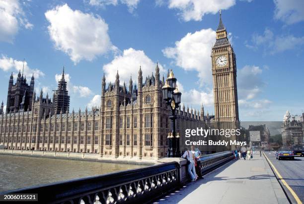 View of Big Ben and Parliament from the Westminster Bridge, on the Thames River in downtown London, England, 1999. .