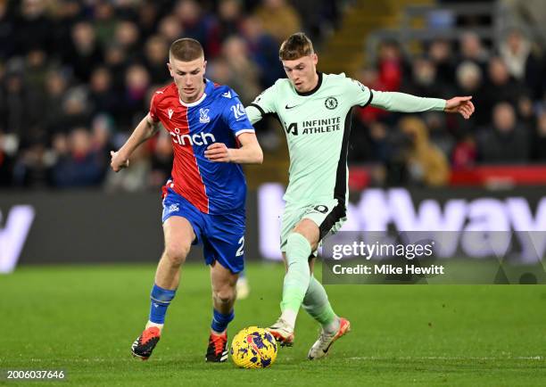 Adam Wharton of Crystal Palace is challenged by Cole Palmer of Chelsea during the Premier League match between Crystal Palace and Chelsea FC at...