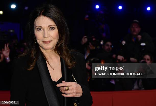 German actress Iris Berben poses on the red carpet prior to the opening ceremony of the 74th Berlinale, Europe's first major film festival of the...