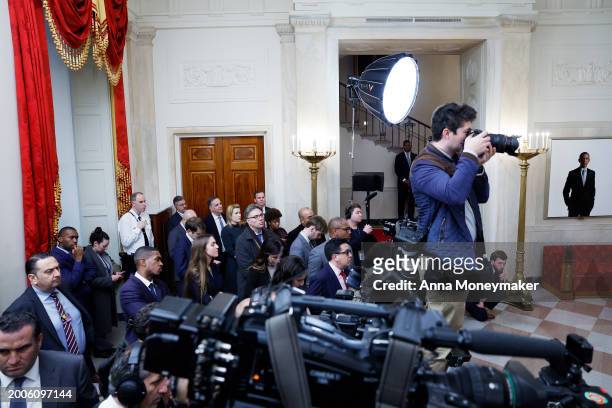 Reporters and staff watch as U.S. President Joe Biden delivers remarks alongside King of Jordan Abdullah II ibn Al Hussein after a meeting at the...