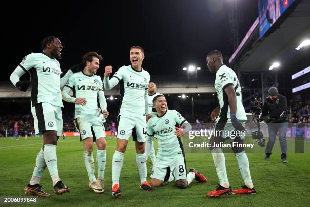 Enzo Fernandez of Chelsea celebrates with team mates after scoring his team's third goal during the Premier League match between Crystal Palace and...