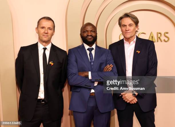 John Battsek, Moses Bwayo and Christopher Sharp attend the 96th Oscars Nominees Luncheon at The Beverly Hilton on February 12, 2024 in Beverly Hills,...