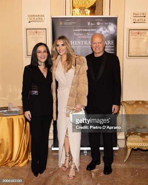 Francesca De Stefano, Michela Persico and Santo Versace attends a photocall for "L'Orchestra Del Mare" at Teatro Alla Scala on February 12, 2024 in...