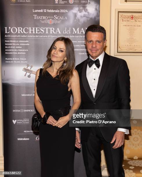 Chiara Lezzi and Fabrizio Politi attend a photocall for "L'Orchestra Del Mare" at Teatro Alla Scala on February 12, 2024 in Milan, Italy.