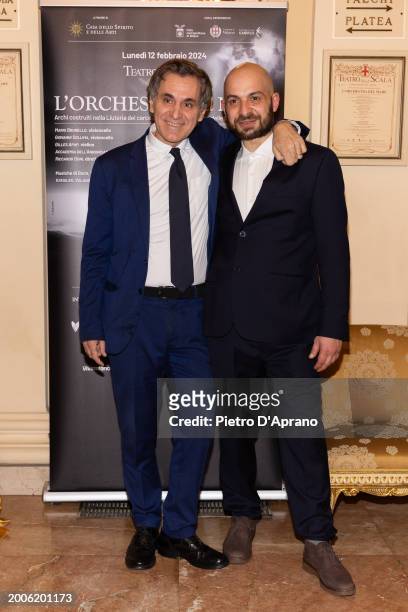 Arnoldo Mosca Mondadori and Claudio Lamponi attends a photocall for "L'Orchestra Del Mare" at Teatro Alla Scala on February 12, 2024 in Milan, Italy.
