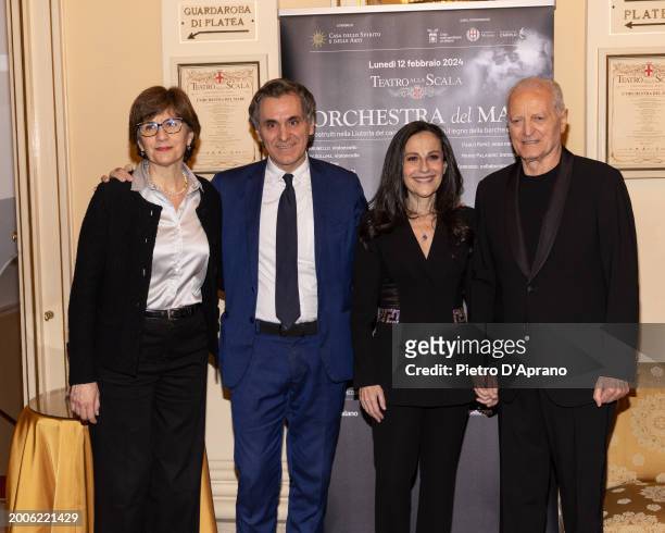 Guest, Arnoldo Mosca Mondadori, Francesca De Stefano and Santo Versace attends a photocall for "L'Orchestra Del Mare" at Teatro Alla Scala on...