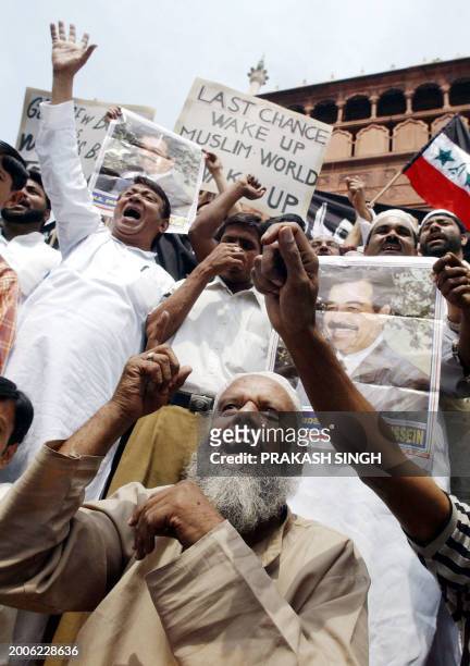 Indian Muslims shout slogans against the US and Britain during a demonstration at the Jama Masjid mosque in New Delhi 23 March 2003 to protest the...