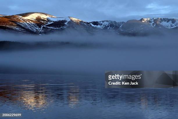 General view of the Cairngorms, as mist swirls over Loch Morlich in the foreground , on February 15, 2024 in Aviemore, Scotland.