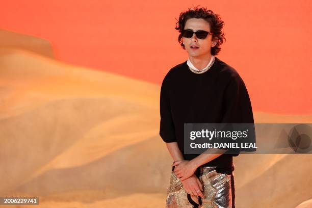 And French actor Timothee Chalamet poses on the red carpet upon arrival for the World premiere of the film "Dune: Part Two" in Leicester Square,...