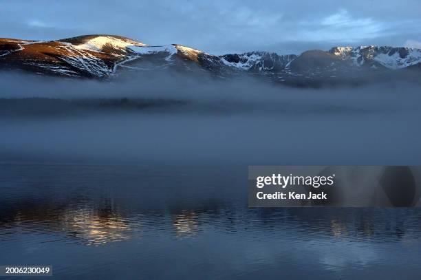 General view of the Cairngorms, as mist swirls over Loch Morlich in the foreground , on February 15, 2024 in Aviemore, Scotland.