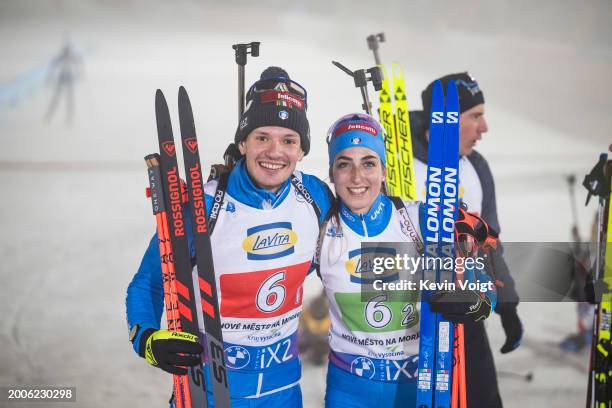 Tommaso Giacomel of Italy and Lisa Vittozzi of Italy celebrates in the finish for placing second at the Single Mixed Relay at the IBU World...