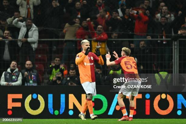 Galatasaray's Argentine forward Mauro Icardi celebrates with Galatasaray's Turkish defender Baris Alper Yilmaz after scoring a goal during the UEFA...