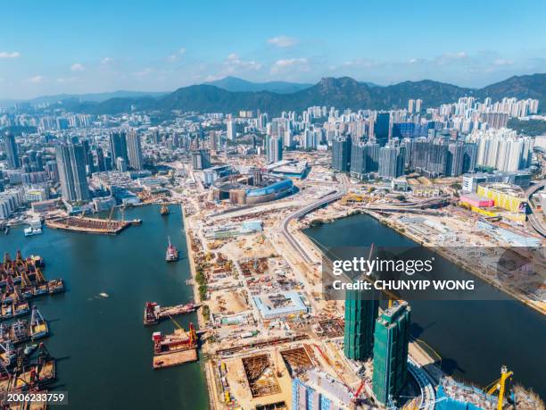 drone view of construction site in kai tak, hong kong - harbor east stock pictures, royalty-free photos & images