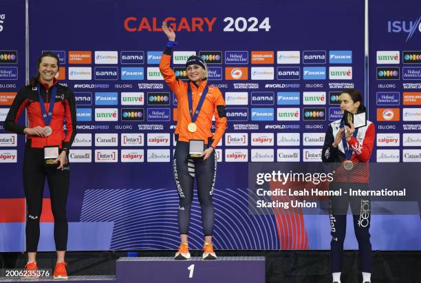 Isabelle Weidemann of Canada, left, silver medal, Irene Schouten of the Netherlands, gold medal and Martina Sablikova of the Czech Republic, bronze...