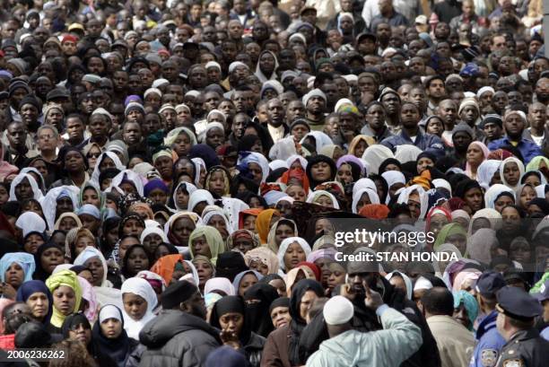 Part of the overflow crowd of mourners that stretched two blocks from the Islamic Cultural Center, 12 March 2007, in the Bronx borough of New York...