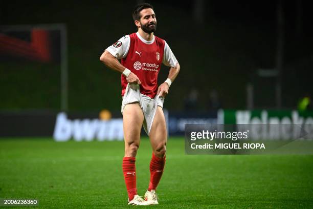 Sporting Braga's Portuguese midfielder Joao Moutinho reacts stretching his shorts during the UEFA Europa League group stage first leg football match...