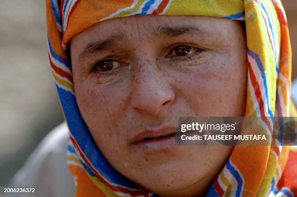 Kashmiri Muslim woman cries as she takes part in a demonstration with others in Srinagar, 24 February 2007, as they seek answers to the fate of their...