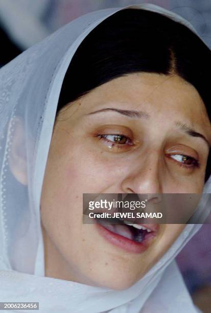 The sister of Pakistani Sajid Naeem, Ruma Naeem, cries as she mourns his death, 29 July 2004, in Rawalakot, some 75 kms northeast of Islamabad....