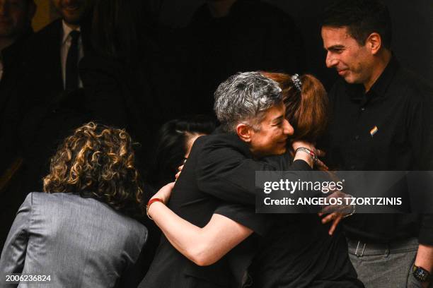 Visitors react after the parliamentary vote on same-sex marriage in Athens, on February 15, 2024. The legalization of same-sex marriage in Greece,...