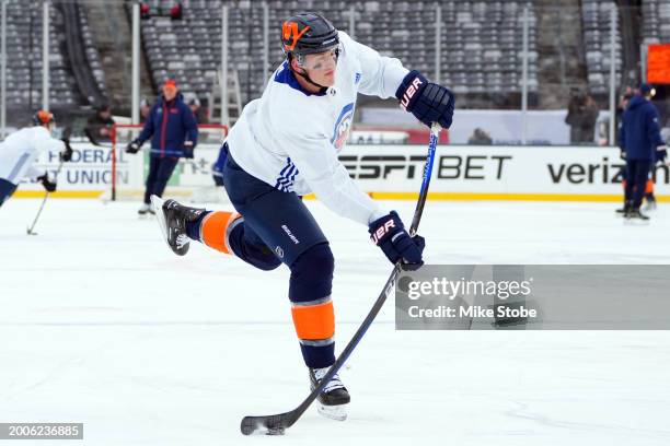 Hudson Fasching of the New York Islanders attempts a shot during the 2024 Navy Federal Credit Union Stadium Series - New York Islanders Practice &...