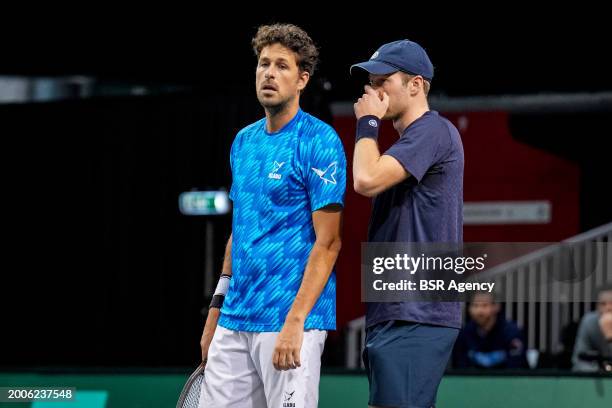 Robin Haase and Botic van de Zandschulp of the Netherlands talk tactics during Day 4 of the ABN AMRO Open 2024 at the Rotterdam Ahoy on February 15,...