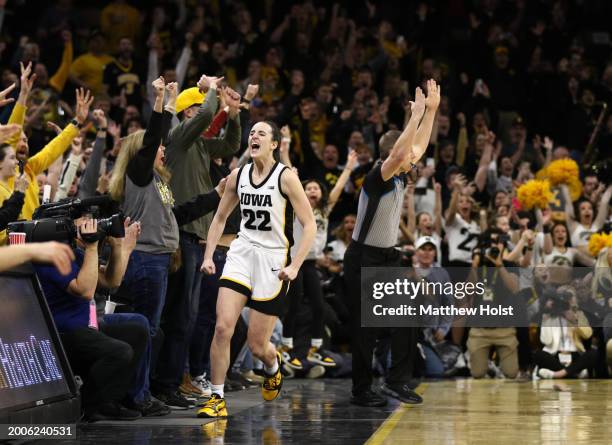 Guard Caitlin Clark of the Iowa Hawkeyes celebrates after breaking the NCAA women's all-time scoring record during the first half against the...