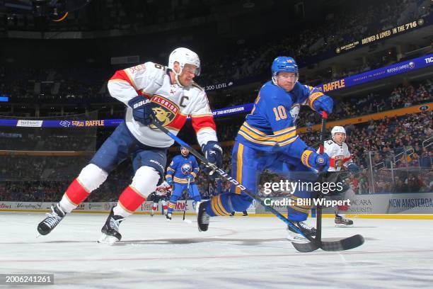 Aleksander Barkov of the Florida Panther is defended by Henri Jokiharju of the Buffalo Sabres during an NHL game on February 15, 2024 at KeyBank...