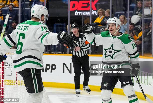 Sam Steel celebrates his goal with Joe Pavelski of the Dallas Stars against the Nashville Predators during an NHL game at Bridgestone Arena on...
