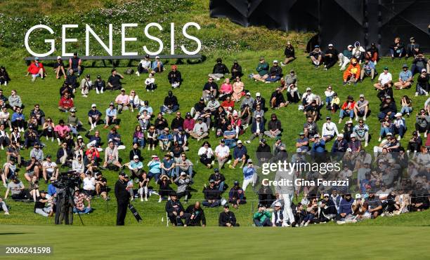 Tiger Woods lines up his putt on the 18th hole during the first round of the Genesis Invitational at Riviera Country Club on February 15, 2024 in Los...