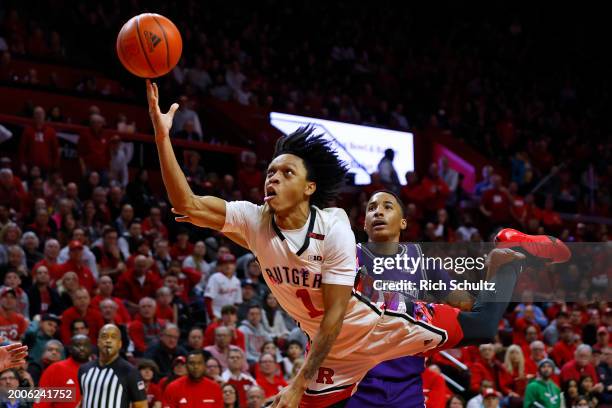 Jamichael Davis of the Rutgers Scarlet Knights puts up a shot ahead of Justin Mullins of the Northwestern Wildcats in the second half at Jersey...