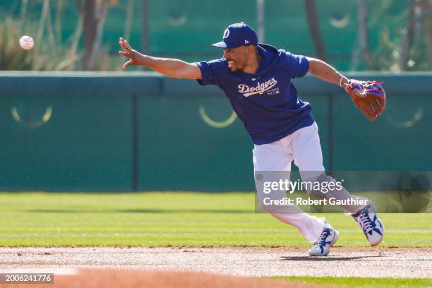 Goodyear, Arizona, Thursday, February 15, 2024 - Dodgers second baseman Mookie Betts fields grounders during day two of spring training at Camelback...