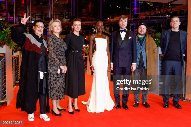 Ann Hui, Oksana Zabuzhko, Jasmine Trinca, Lupita Nyong'o, Albert Serra, Brady Corbet and Christian Petzold during the "Small Things Like These"...