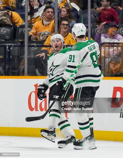 Matt Duchene celebrates his goal with Tyler Seguin of the Dallas Stars against the Nashville Predators during an NHL game at Bridgestone Arena on...