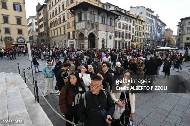 Tourists queue to enter in the Duomo in Florence, on February 15, 2024. A lot of historic workshops fear to close in Florence due to over tourism....