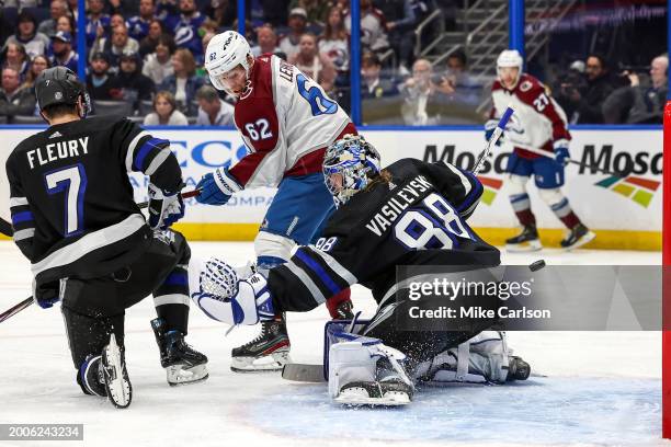 Artturi Lehkonen of the Colorado Avalanche tips a goal past Andrei Vasilevskiy of the Tampa Bay Lightning during the third period of the game at the...