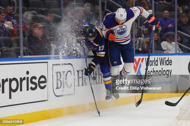 Vincent Desharnais of the Edmonton Oilers checks Alexey Toropchenko of the St. Louis Blues during the third period at Enterprise Center on February...