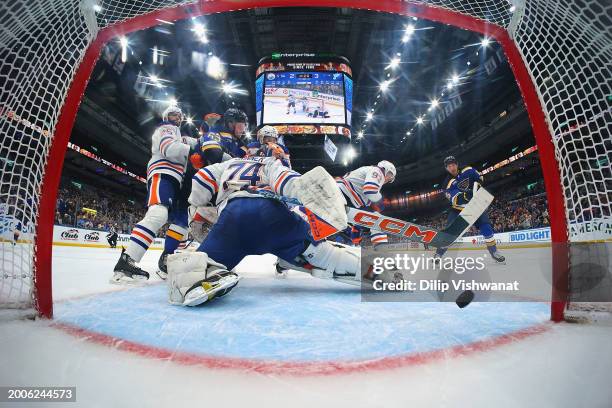 Jordan Kyrou of the St. Louis Blues scores a goal against Stuart Skinner of the Edmonton Oilers at Enterprise Center on February 15, 2024 in St...