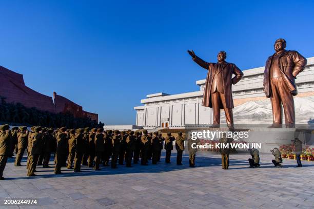 People visit the statues of late North Korean leaders Kim Il-Sung and Kim Jong-Il to pay their respects on the occasion of the 82nd birthday of late...