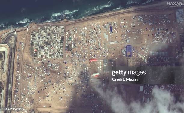 Maxar satellite imagery of tents and shelters for displaced person near the Rafah border crossing into Egypt. Please use: Satellite image 2024 Maxar...