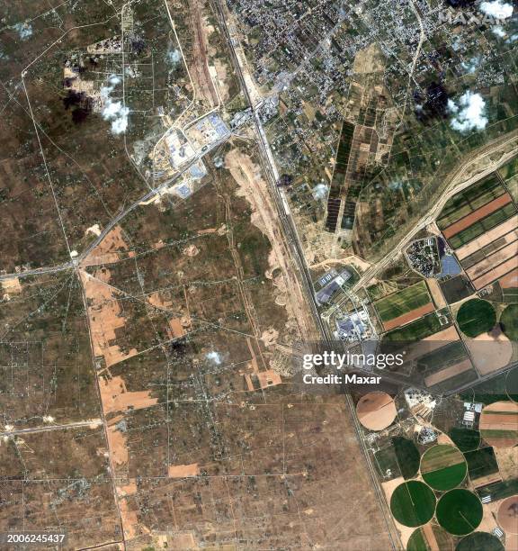 Maxar satellite imagery new construction and earth grading in Egypt near the Rafah border crossing. Please use: Satellite image 2024 Maxar...