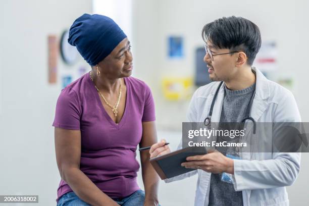 seniors oncology check-up - oncologist stock pictures, royalty-free photos & images