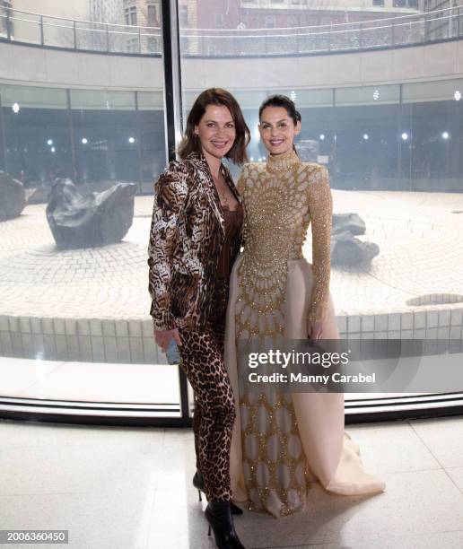 Julia Lemigova and Madlena Kalinova attend the Naeem Khan show during New York Fashion Week on February 12, 2024 in New York City.