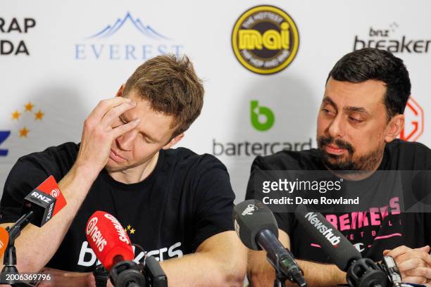 Tom Abercrombie with head coach in Mody Maor reacts as he speaks to the media during his retirement announcement at Breakers HQ on February 13, 2024...