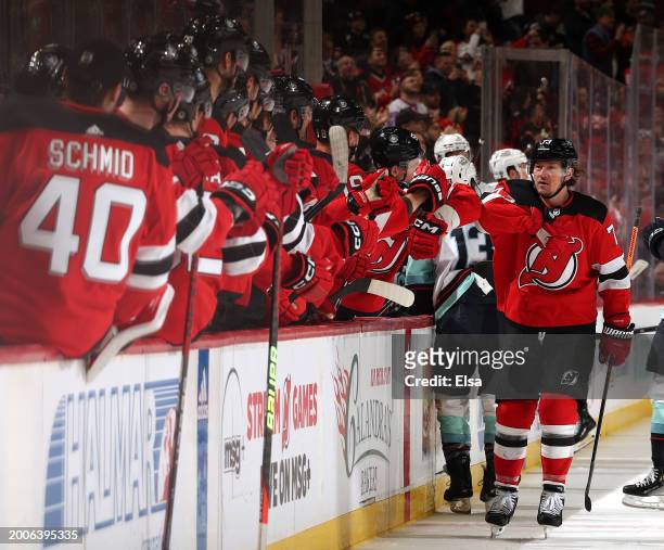 Tyler Toffoli of the New Jersey Devils celebrates his power play goal with teammates on the bench during the first period against the Seattle Kraken...